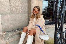 a neutral winter look with a white sweater dress, a an coat, a neutral bag, white chunky boots