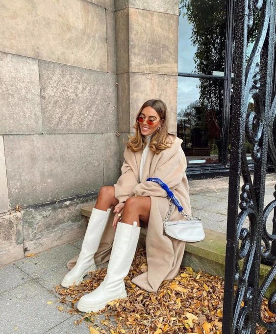 a neutral winter look with a white sweater dress, a an coat, a neutral bag, white chunky boots