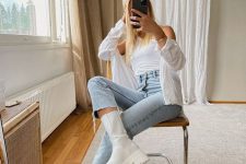 a white top and ahisrt, light blue high waisted jeans, light beige tall chunky Chelsea boots for a statement