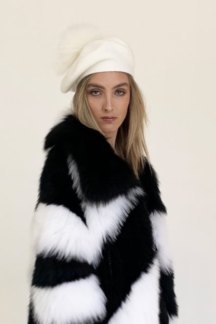 With black and white faux fur coat, shirt and jeans