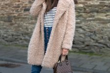 With black and white striped shirt, cuffed jeans, black ankle boots, printed bag and pale pink teddy bear coat