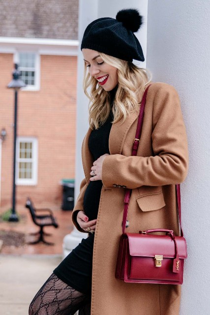 With black mini dress, brown coat and marsala leather bag