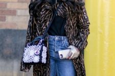 With black shirt, leopard printed knee-length coat, navy blue and pale pink bag and jeans