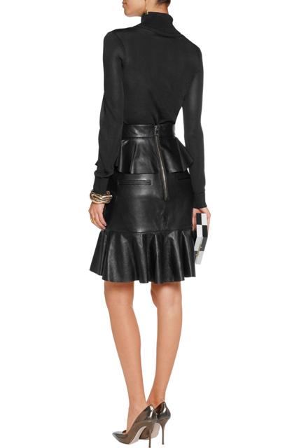 With black turtleneck, black and white clutch and silver high heels