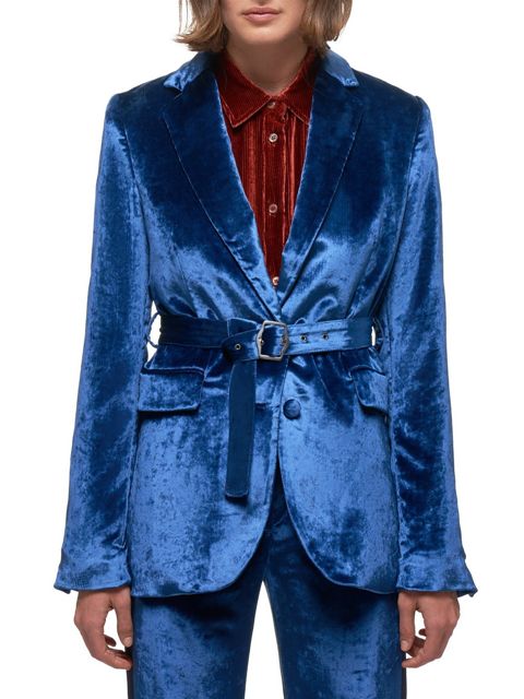 With brown corduroy button down shirt and cobalt blue velvet pants