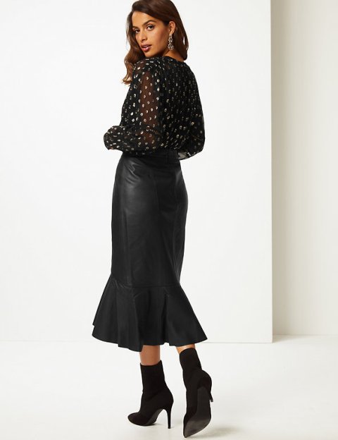 With printed blouse and black suede mid calf boots