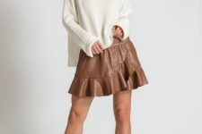 With white loose turtleneck sweater and brown leather mid calf heel boots