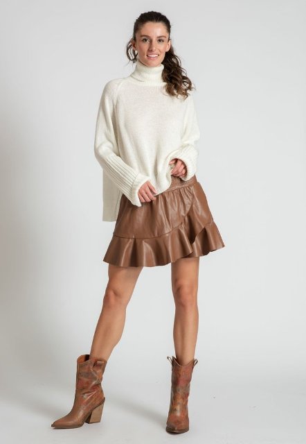 With white loose turtleneck sweater and brown leather mid calf heel boots
