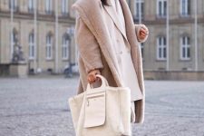 With white turtleneck, beige oversized blazer, pants, tote bag and sneakers