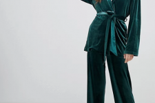 With white turtleneck, emerald green loose pants and white leather heeled boots