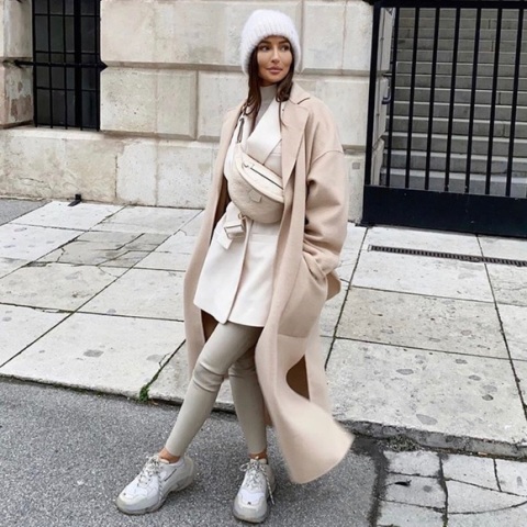 With white turtleneck, white long blazer, leggings, white sneakers, beige bag and pastel colored maxi coat
