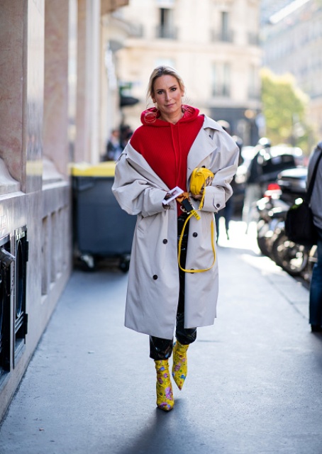 With yellow leather bag, colorful printed mid calf boots and black leather cropped pants