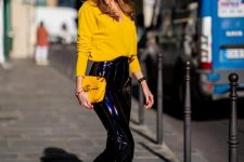 With yellow loose shirt, yellow leather clutch, sunglasses and yellow high heels