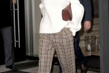 a Christmas work look that is comfy and stylish – an oversized white jumper, plaid trousers, white shoes and a brown bag