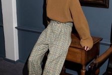 a beige ribbed oversized jumper, grey and tan plaid trousers, tan lace up booties for a simple and chic look