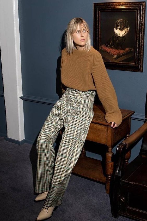 a beige ribbed oversized jumper, grey and tan plaid trousers, tan lace up booties for a simple and chic look