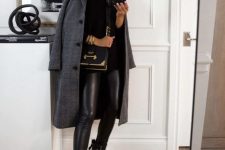 a black turtleneck sweater, black combat boots, black leather leggings, a grey plaid coat and a black and gold bag