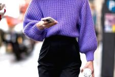 a chic and trendy outfit with a purple high neck chunky knit sweater, black high waisted trousers and a black bag