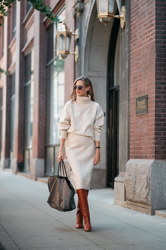 a chic winter work look with a white turtleneck sweater, a midi skirt, amber leather boots and a printed tote