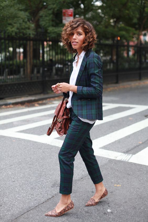 a dark green tartan pantsuit, a white shirt, brown snakeskin flats, a brown bag for a chic and cool look on holidays