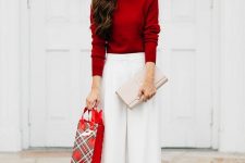 a deep red turtleneck, white culottes, nude shoes and a clutch plus statement earrings compose a great party or work outfit
