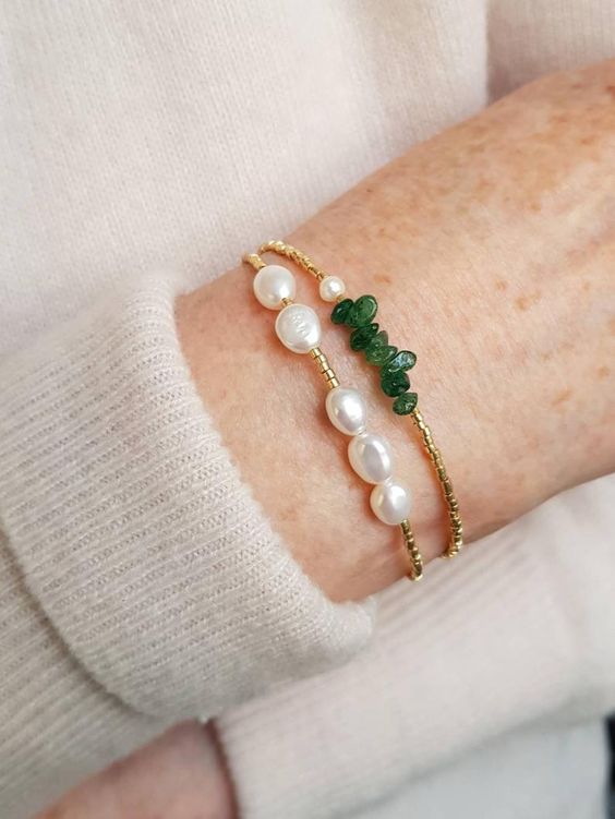 a duo of bracelets of gold seed beads, jade crystals and baroque pearls for a lovely and catchy look