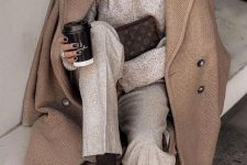 a grey turtleneck sweater, matching trousers, a textural beige coat, black socks and dark brown loafers for work