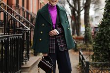 a hot pink turtleneck, a pink and green plaid blazer, black culottes, green socks, brown shoes, a green cropped coat