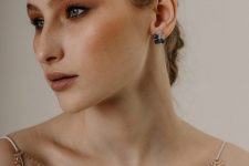 a jaw-dropping party or special occasion look with beautiful two-tone flower statement earrings that accent the eye color