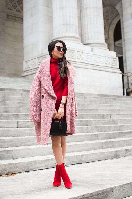 a lovely red sweater dress, matching boots, a pink faux fur coat and a black box bag look super chic and cool yet work-appropriate