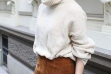 a lovely winter work look with a creamy chunky oversized sweater, a brown suede mini and black tights