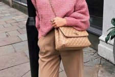a pink ribbed turtleneck sweater, tan cropped trousers, a pink headband, tan loafers and a bag fo r a girlish winter work look