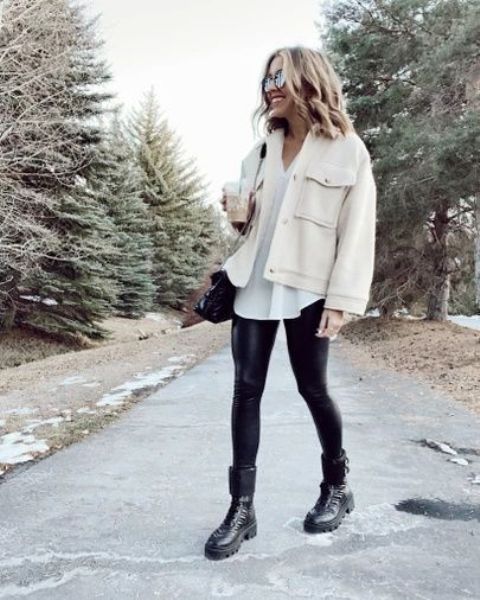 a pretty winter look with a white jumper, black leather leggings, black combat boots, a creamy shirtjacket and a black bag