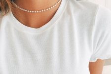 a simple mini pearl choker paired with a white t-shirt creates a right contrast and elevates the style