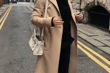 a stylish look with a black hoode, leggings and sneakers, a beige midi coat and a neutral bag is comfy and lovely