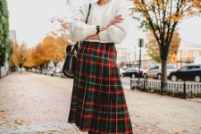 a cute Christmas outfit with a plaid skirt