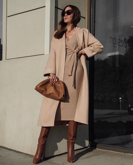 an elegant monochromatic winter work outfit with a knit wrap midi dress, a matching coat, brown boots and a clutch