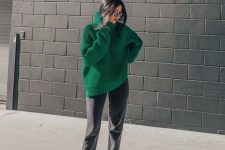 an oversized emerald turtleneck sweater, grey jeans, black suede shoes for a wow look in the fall or winter