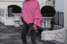 an oversized pink sweater, grey cropped skinnies, white trainers and a black Dior clutch for a chic look