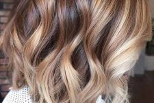 brunette hair with blonde and caramel balayage, with waves is a chic and bright idea to stand out