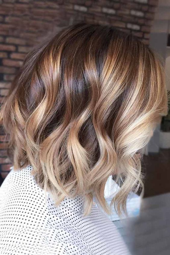 brunette hair with blonde and caramel balayage, with waves is a chic and bright idea to stand out