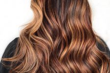 dark hair with sunset caramel highlights starting on the lower half to get an effortless transition