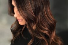 rich chocolate brown locks with slight caramel brown highlights that give a more eye-catchy look to the hairstyle