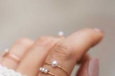 stacked gold rings with pearls are a cool and dreamy idea to spruc eup your outfit in any season