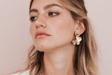super chic and shiny gold flower earrings like these ones can be worn to many places and they will make a statement in your look for sure