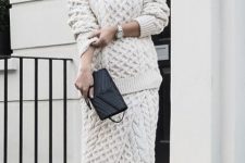 02 a beautiful creamy knit co-ord set with a pretty pattern, black heels and a black clutch for winter