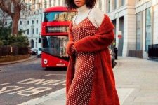 02 a bright winter work look with a white turtleneck, a red polka dot maxi slip dress, a red faux fur jacket and white sneakers