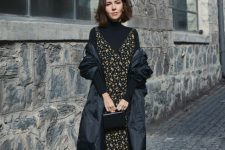 03 a refined and feminine work look with a black turtleneck, a dark floral slip midi dress, black boots and a black trench plus a bag