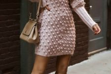 04 a blush pompom mini sweater dress with a high neckline and puff sleeves, a tan bag and tan knee boots