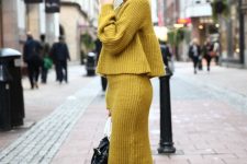 05 a bold look with a mustard ribbed knit set with a skirt and a flare sweater, beige hiking boots and a black bag
